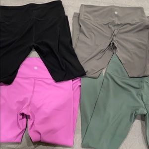 4 pairs of athleta elation leggings , size small
